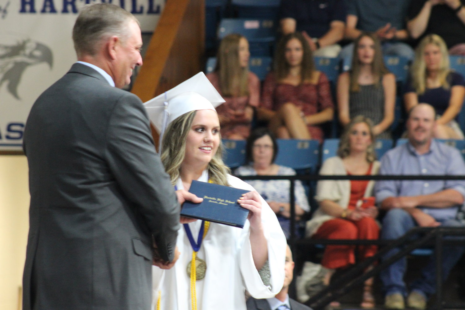 Salutatorian Bailey Martin receives her diploma.